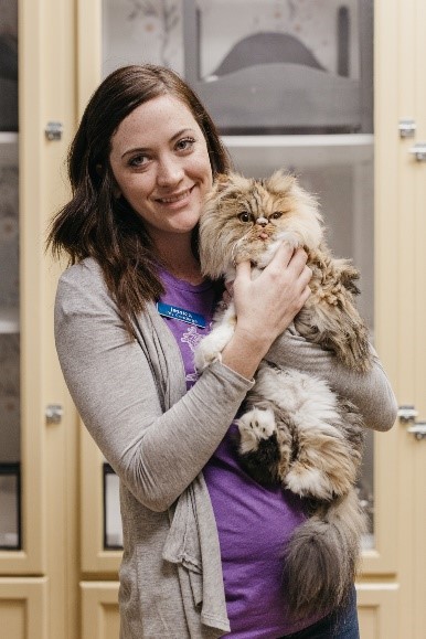 PPI Staff with cat Employee holding a cat