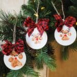 Three reindeer paw painting ornaments hung together