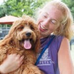 Pet Handler holding a dog