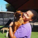 Handler holding a dog