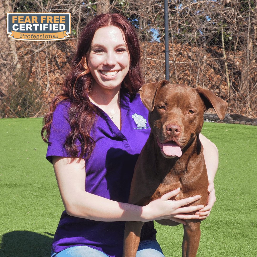 Office Supervisor posing with her dog