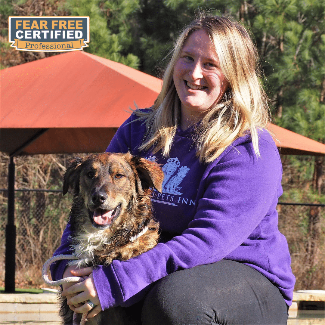 Pet Services Manager posing with her dog