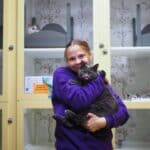 Staff holding a cat