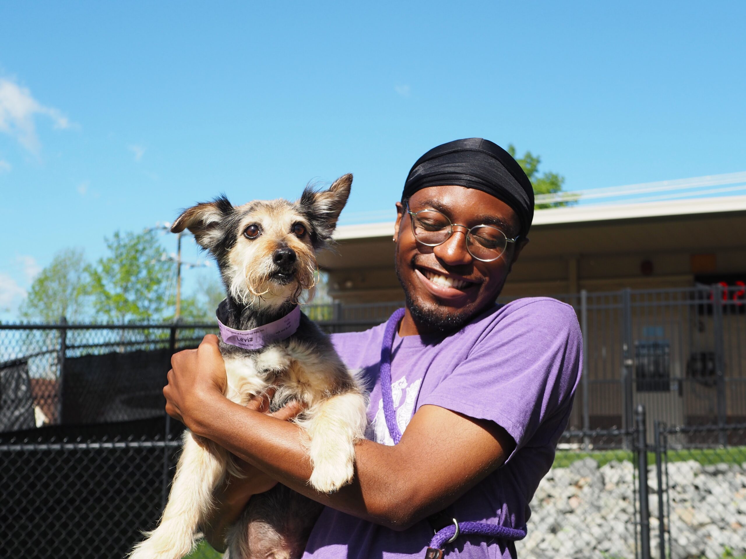 Handler holding dog