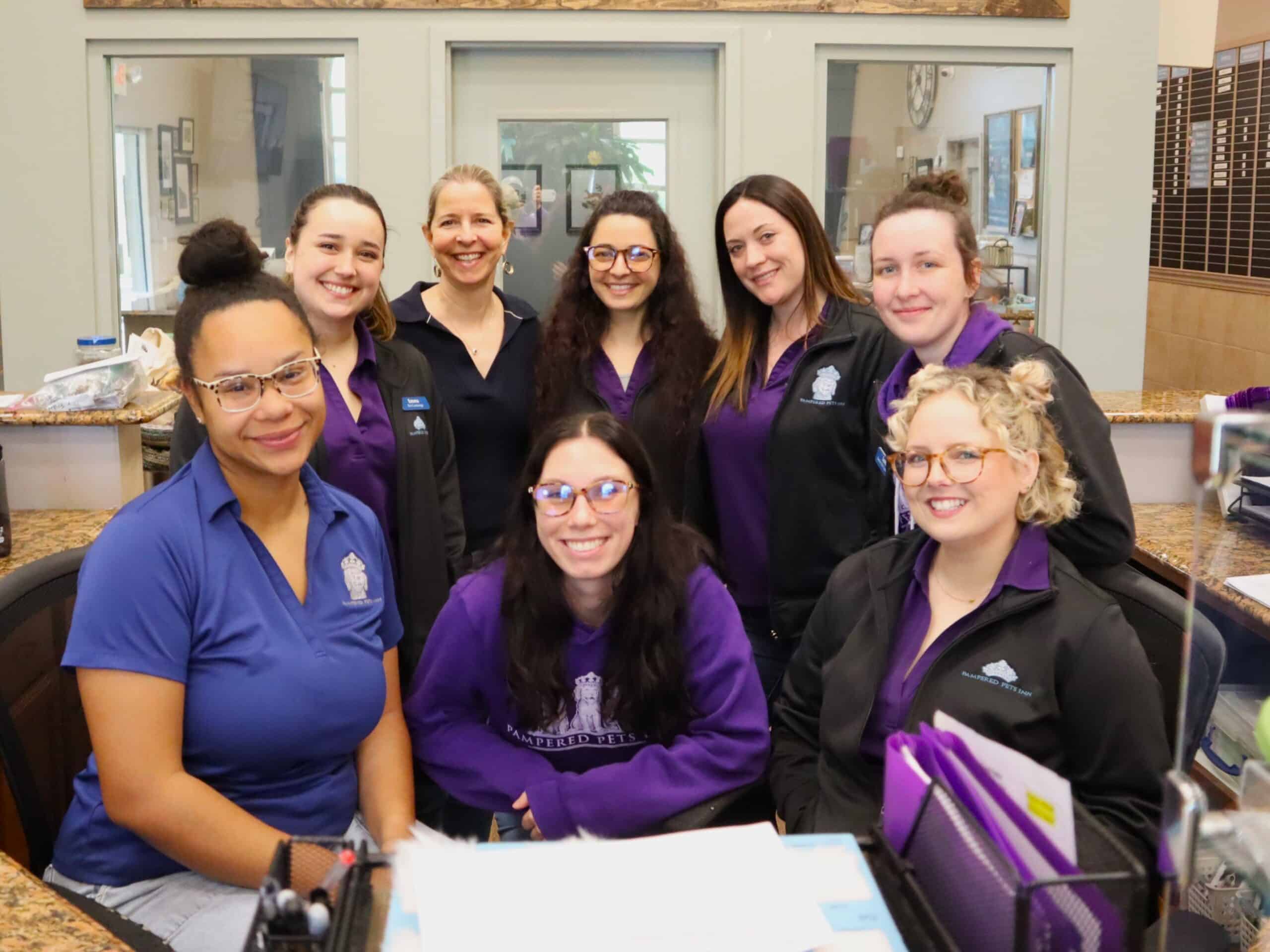 office group of Pet Concierges at the front desk