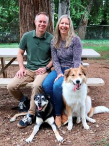 Co-owners Chris & Karen with their dogs Macy & Finley.
